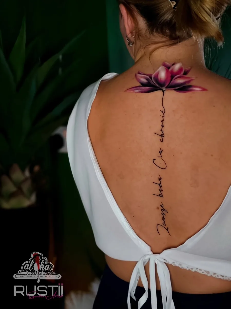 Fine line lotus and script down the spine, by Thomas Palaniuk